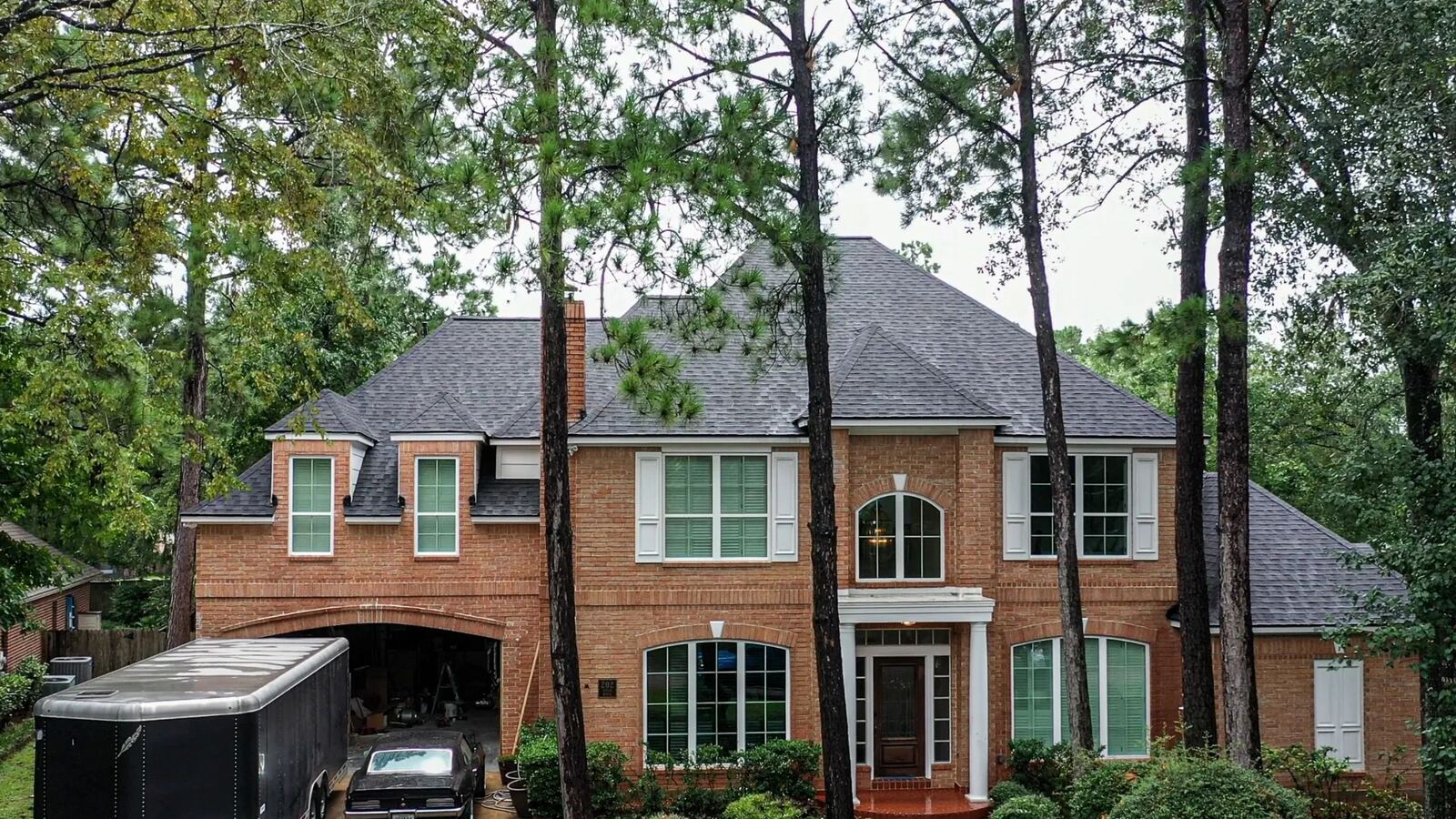 Brick two-story home with newly installed roof